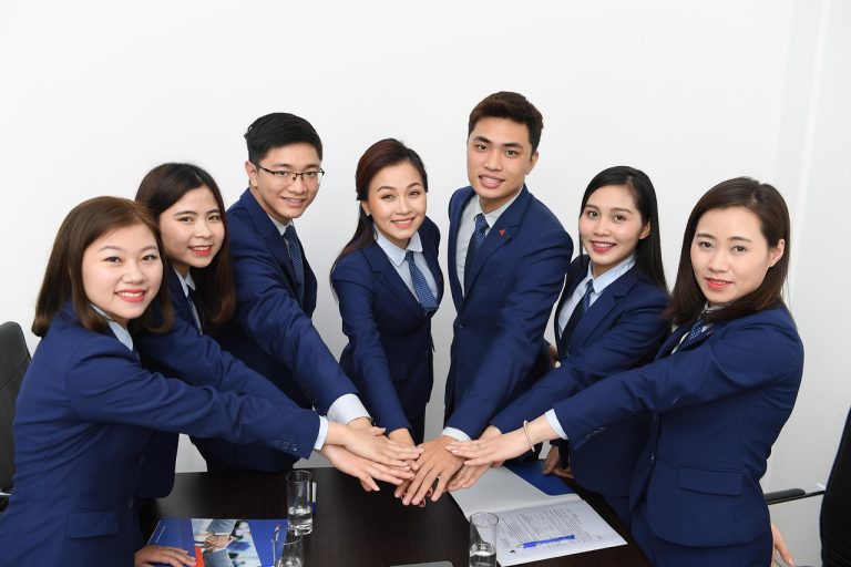 Team, business, asians — How Dr Michael Lebow Helps Patients Avoid Major Surgery Through Intervention